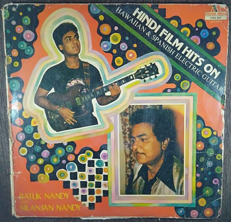 Batuk Nandy and Nilanjan Nandy – Hindi Film Hits On Hawaiian & Spanish Electric Guitar (1982) Batuk Nandy and Nilanjan Nandy Pre-Owned Vinyl, 12" LP Record