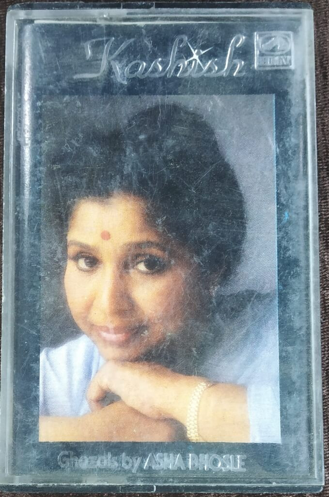 Asha Bhosle – Kashish Ghazals From Umrao Jaan And Kashish By Asha Bhosle (1988) Nazar Hussain, Master Abdullah Pre-Owned HMV Audio Cassette